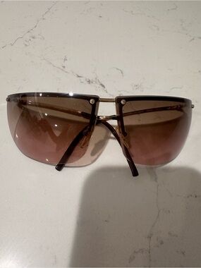 2002  Gucci 2652/S brown and gold rimless sunglasses.